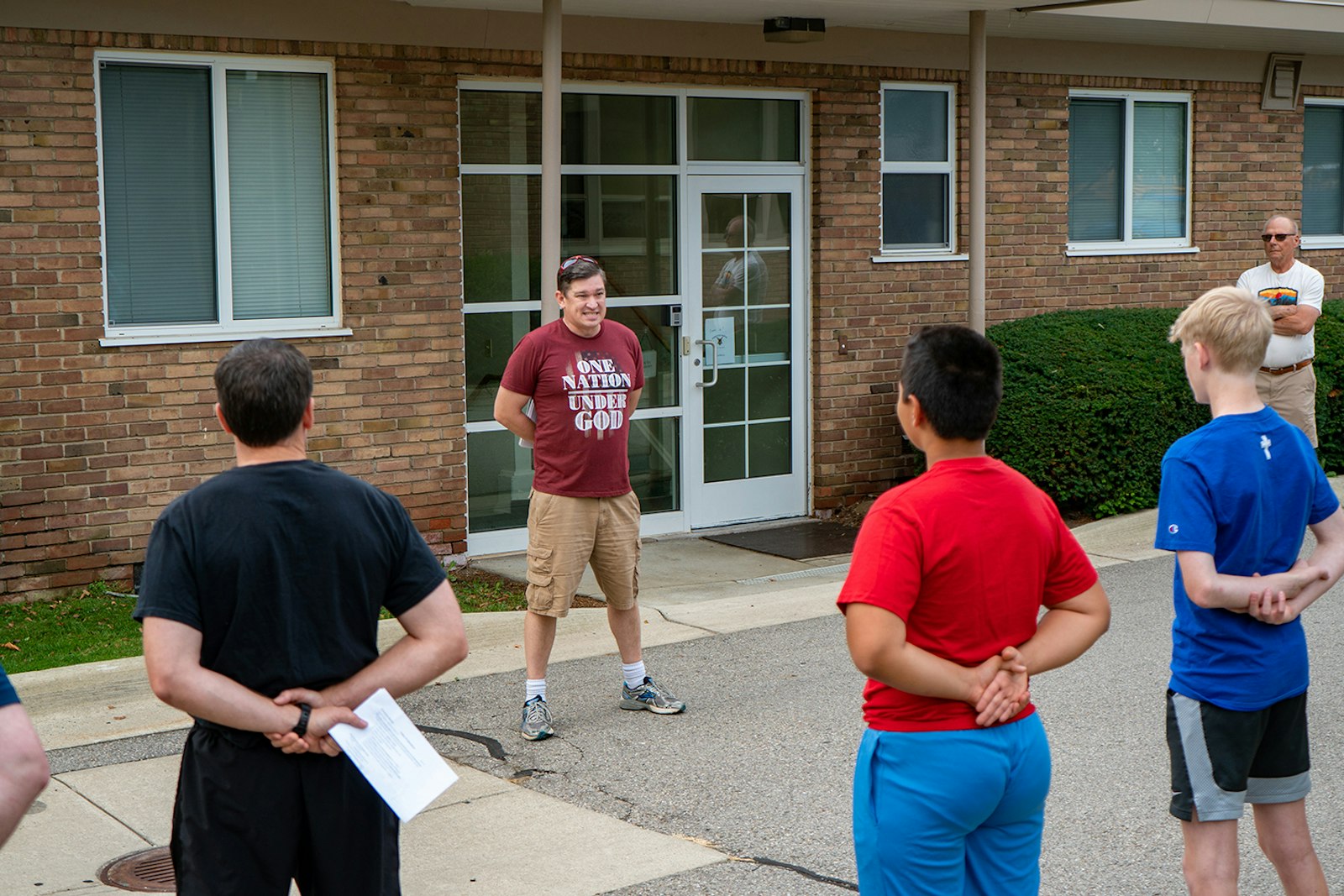 Kyle Redding, a parishioner of Our Lady of Sorrows Parish in Farmington who served in the U.S. Army from 2004-12, addresses a lineup of boys during an "Exercitus Mariae" youth group meeting Aug. 20. In addition to middle school boys, fathers are invited to attend alongside their sons.