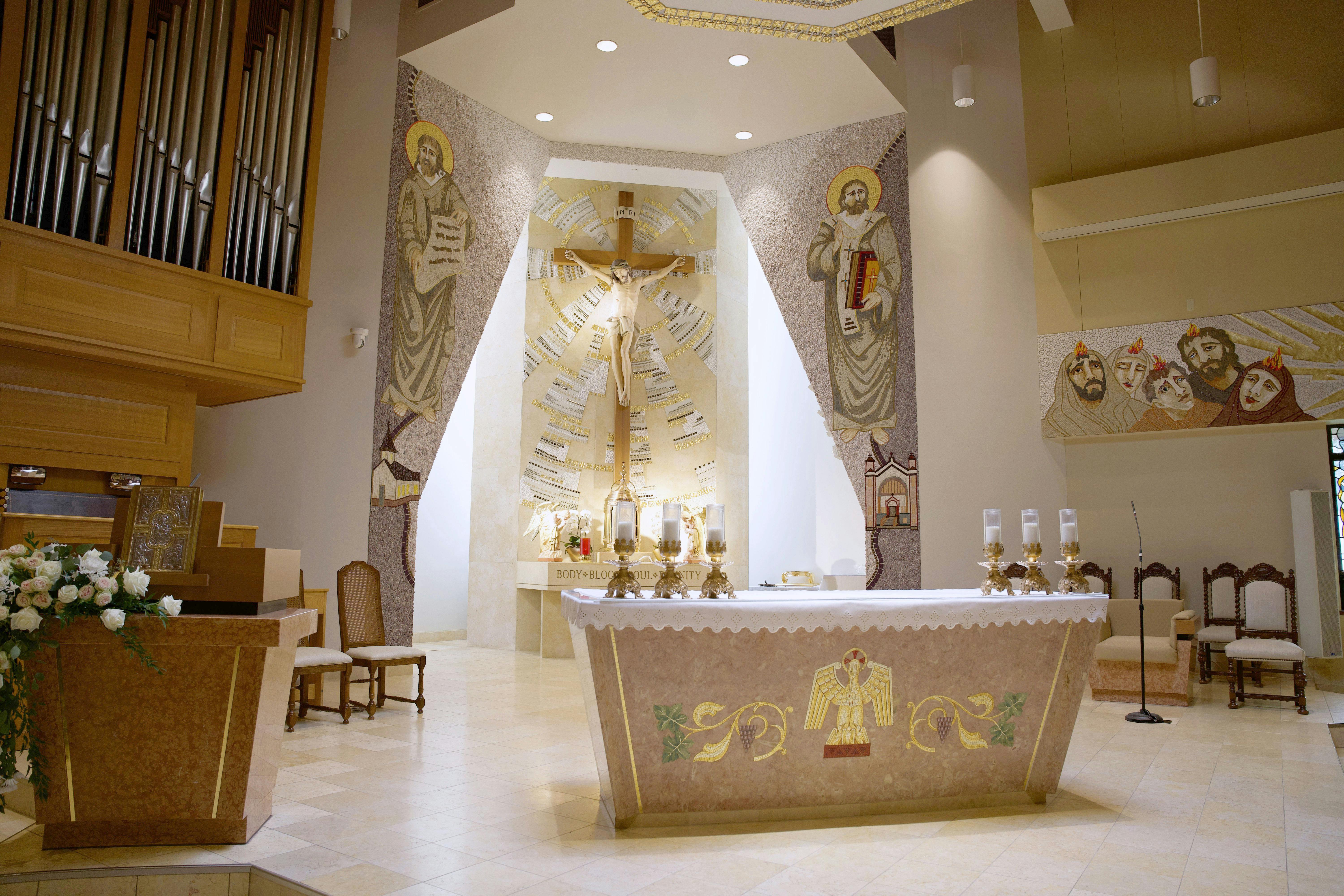 The altar is now flanked by images of SS. Cyril and Methodius, the patrons of the Slovak people. An image of the small wooden church that was first built by Slovak immigrants in the city of Detroit in 1918 is to the left of the altar. On the right is an image of the second structure, which remained the parish's home until 1988 when the community moved from the city to the suburbs.