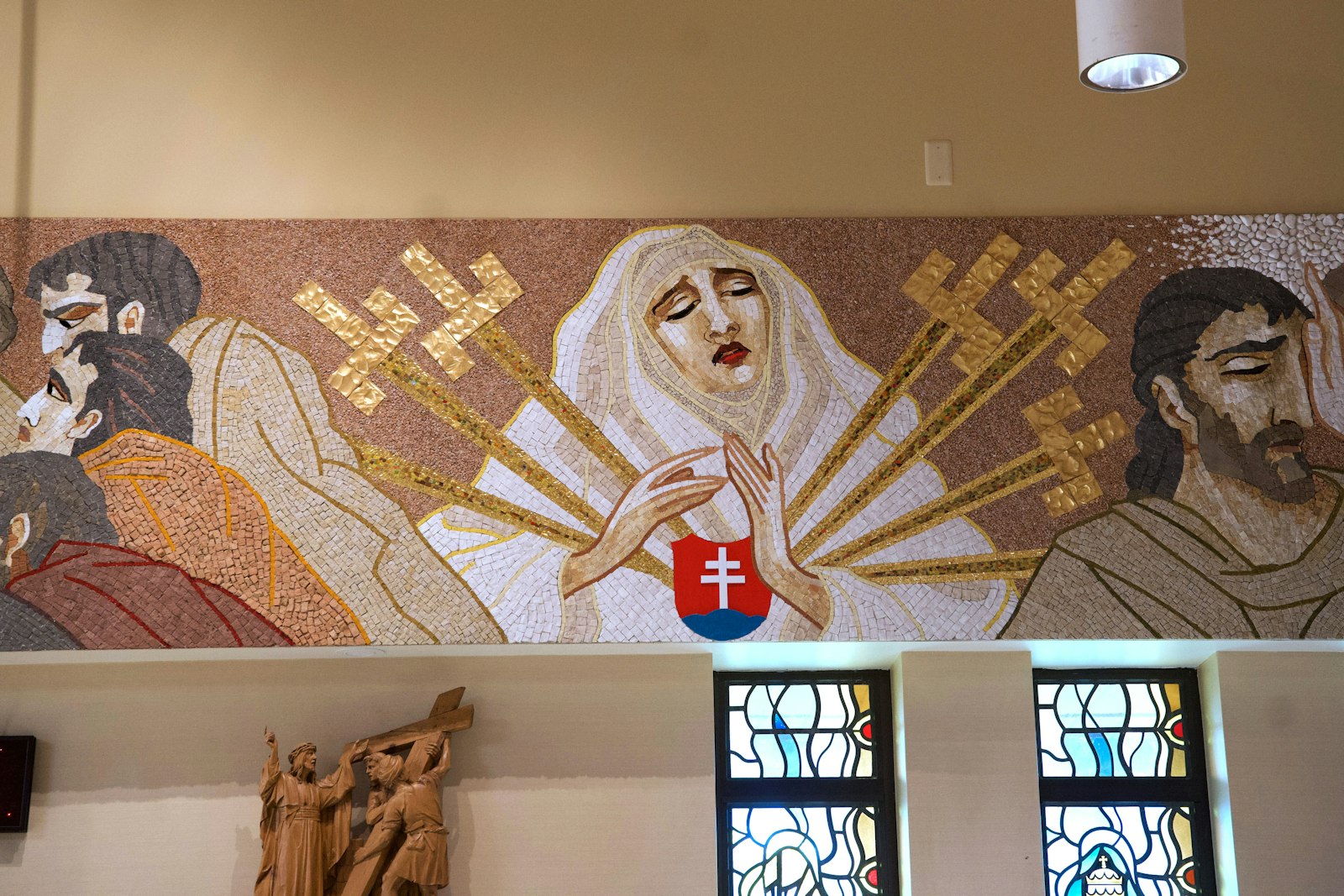 Fr. Drab chose to include an image of Our Lady of Sorrows, her heart pierced by seven swords. She is also wearing the Slovak flag.