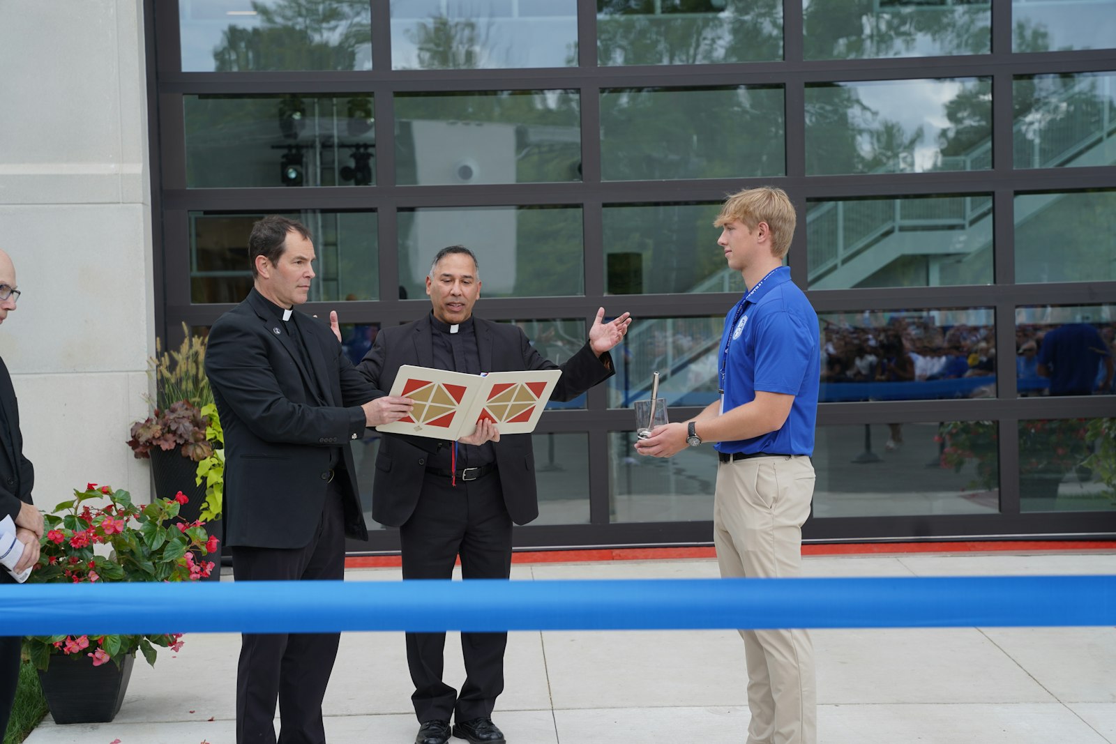 Fr. Kevin Storey, CSB, superior general of the Congregation of St. Basil, the religious order that sponsors Detroit Catholic Central, blesses the George and Mary Turek Hall of Science. The Basilians founded Detroit Catholic Central in 1928, and the new STEM hall is part of school's Vision 100 plan.