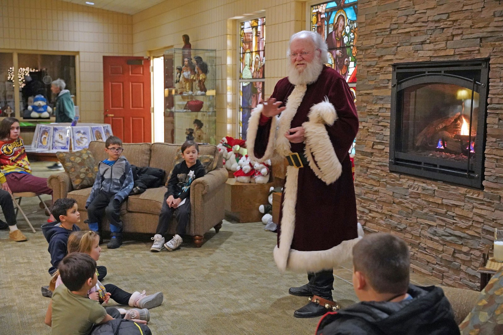 Santa Claus encouraged the youth gathered at St. Kateri Tekakwitha Parish to go out of their way to be kind to one another, help out their parents when they can and to keep the true meaning of Christmas alive all year.