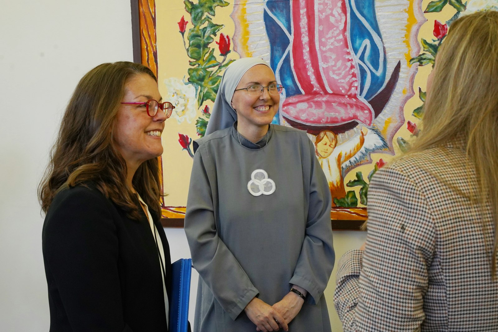 Angela Moloney and Sr. Kateri Burbee, SOLT, principal of Holy Redeemer School in Detroit, speak with Catholic Foundation of Michigan donors.