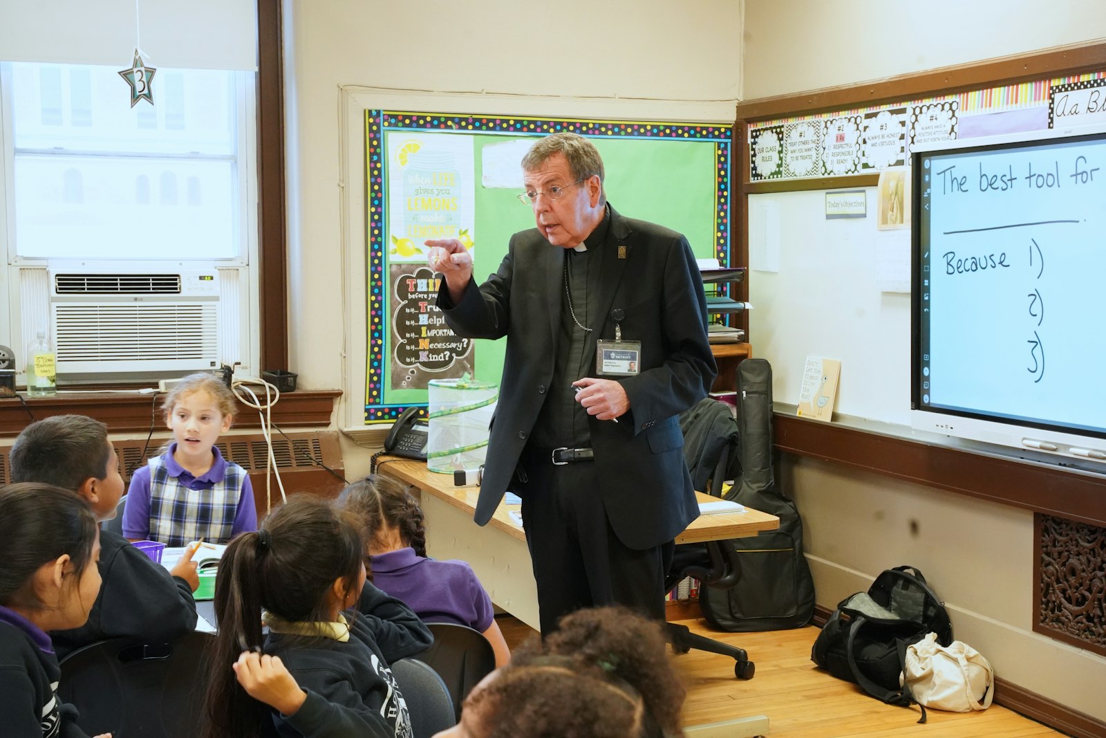 Archbishop Vigneron visited classes at Holy Redeemer School in Detroit after attending a scholarship granting ceremony where 14 students received scholarships.