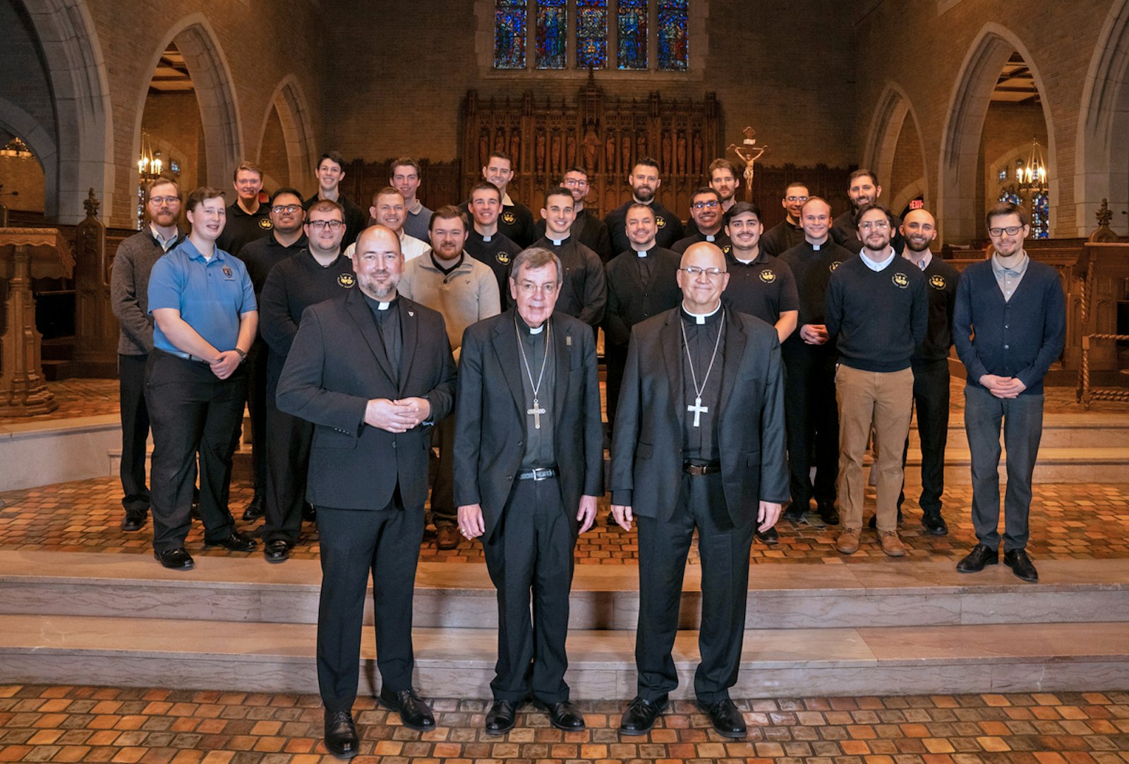 Detroit's seminarians pose for a photograph with Archbishop-designate Edward J. Weisenburger, retiring Archbishop Allen H. Vigneron and Fr. Stephen Burr, Sacred Heart's rector, in the seminary's chapel.