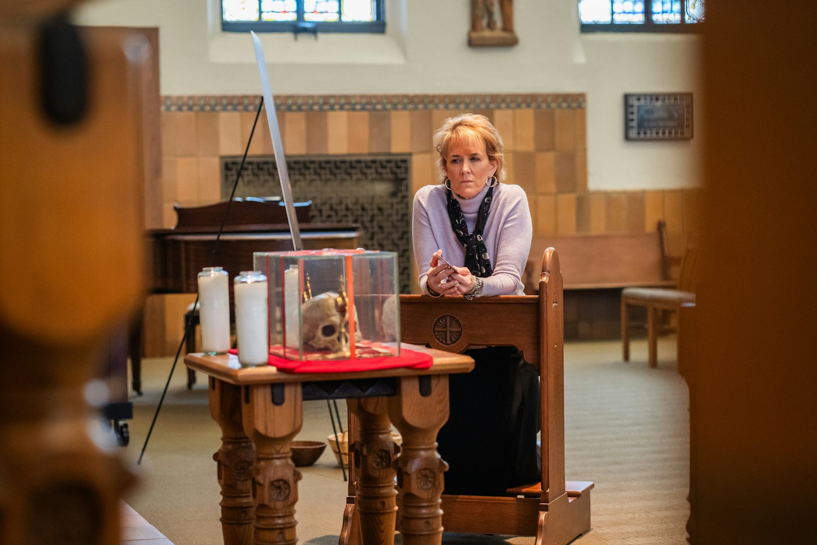 A woman venerates the skull of St. Jean de Brebeuf, a French Jesuit priest who was ministering to the Huron-Wyandot people when he was martyred by an Iroquois war party in 1643.