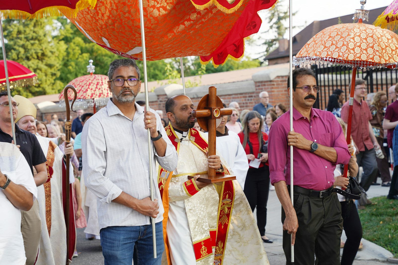 A priest from St. Thomas Syro-Malabar Catholic Church in Southfield holds the relic of Blessed Solanus Casey during a procession following Mass.