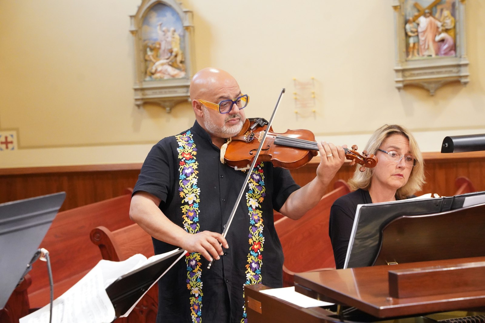 Appropriate for the feast of Blessed Solanus Casey, a violinist performs before Mass at St. Bonaventure Monastery.