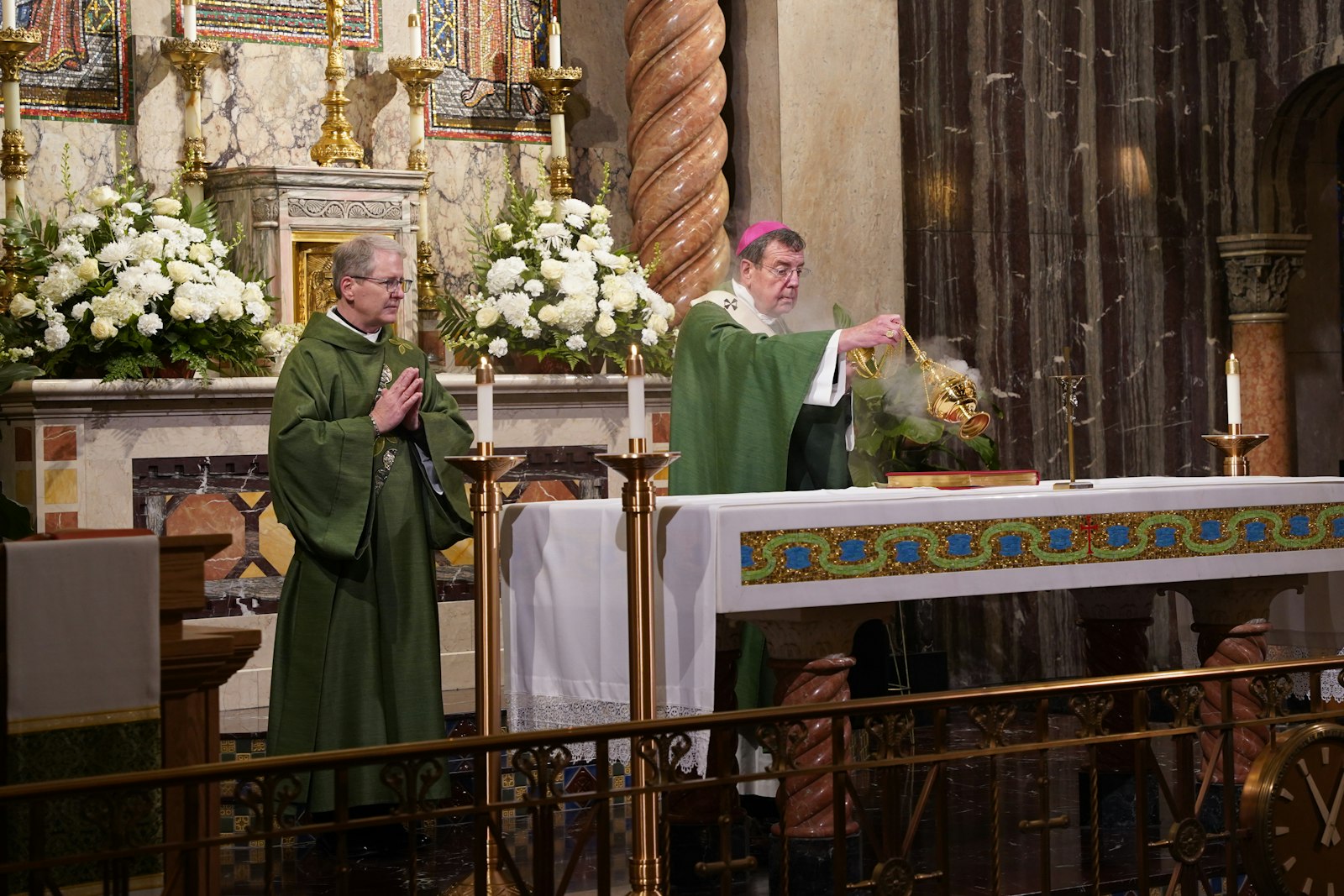 Archbishop Allen H. Vigneron of Detroit incenses the altar at the beginning of the 150th anniversary Mass at St. Aloysius Parish in Detroit. Archbishop Vigneron referred to the church as his “second home,” since its parish boundaries include the Chancery.