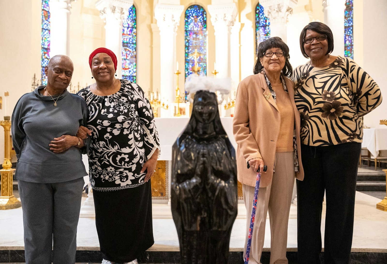 Rene' Vascombe, Vivian King, Alta Sears y Angela Thomas-Wheldon forman parte del Comité del Centenario de San Carlos Lwanga, que planea la celebración de tres días de la parroquia y el trabajo que realiza en el barrio.