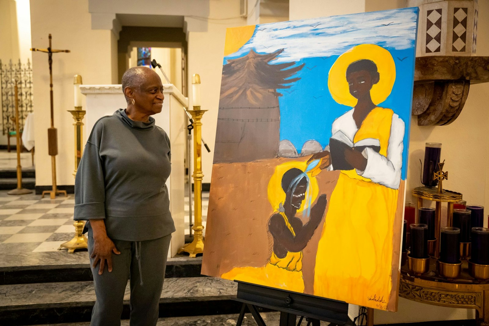 Vivian King looks at a painting of St. Charles Lwanga, a 19th century Ugandan martyr for whom the parish is named.