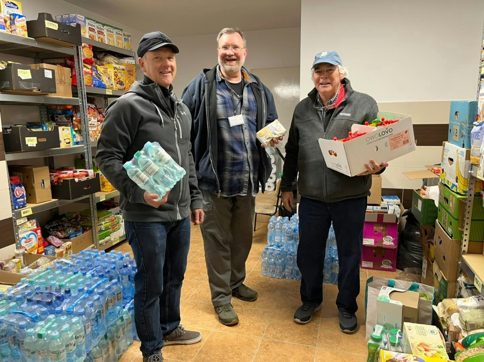 Volunteers from St. Clare of Montefalco Parish sort items at one of the refugee processing centers. The needs change daily, with new refugees arriving and departing almost constantly.