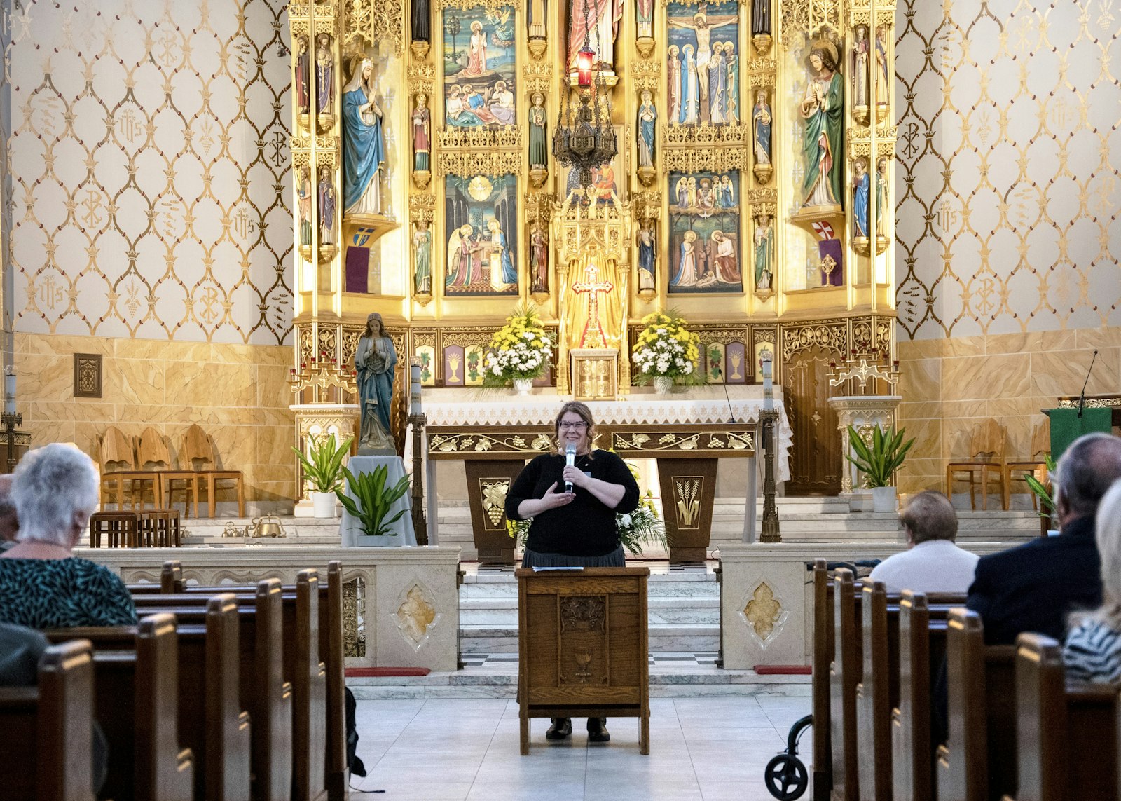 Kathy Fech, sacred worship coordinator for the Archdiocese of Detroit, gives a presentation about the beauty and history of St. Florian Church in Hamtramck, one of the most historic and oldest Polish churches in southeast Michigan, during an Oct. 19 event.