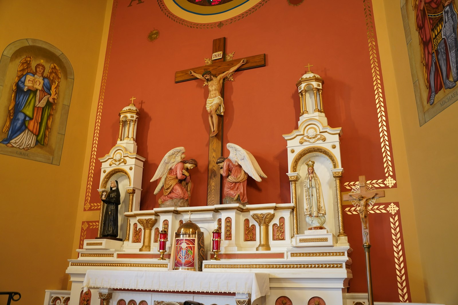 The new restored walls behind the high altar at St. Joseph Parish in Erie. Fr. Slaton noticed water damage in the sanctuary 12 years ago and was glad to see the parish had the funds to repair the damage.