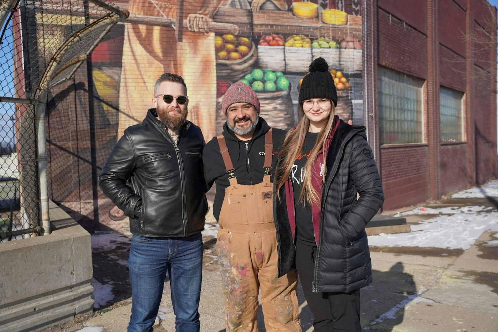 Daniel Egan, had a vision of a mural dedicated to St. Joseph the Worker, and after going through several potential location sites before finding one on Gratiot Avenue, across from St. Joseph Shrine. Egan worked with Detroit artist Elton Duran, and assisting artists Mary Hodges (pictured) and Martina Sanroman. (Photo by Daniel Meloy | Detroit Catholic)