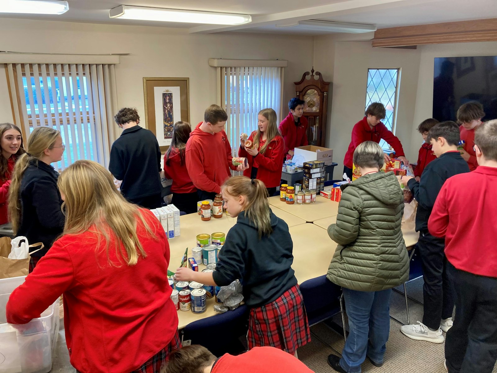 Eighth-graders at St. Joseph School in Trenton organize more than 150 food baskets that were distributed by the Society of St. Vincent de Paul at St. Joseph Parish. (Photo courtesy of St. Joseph School)