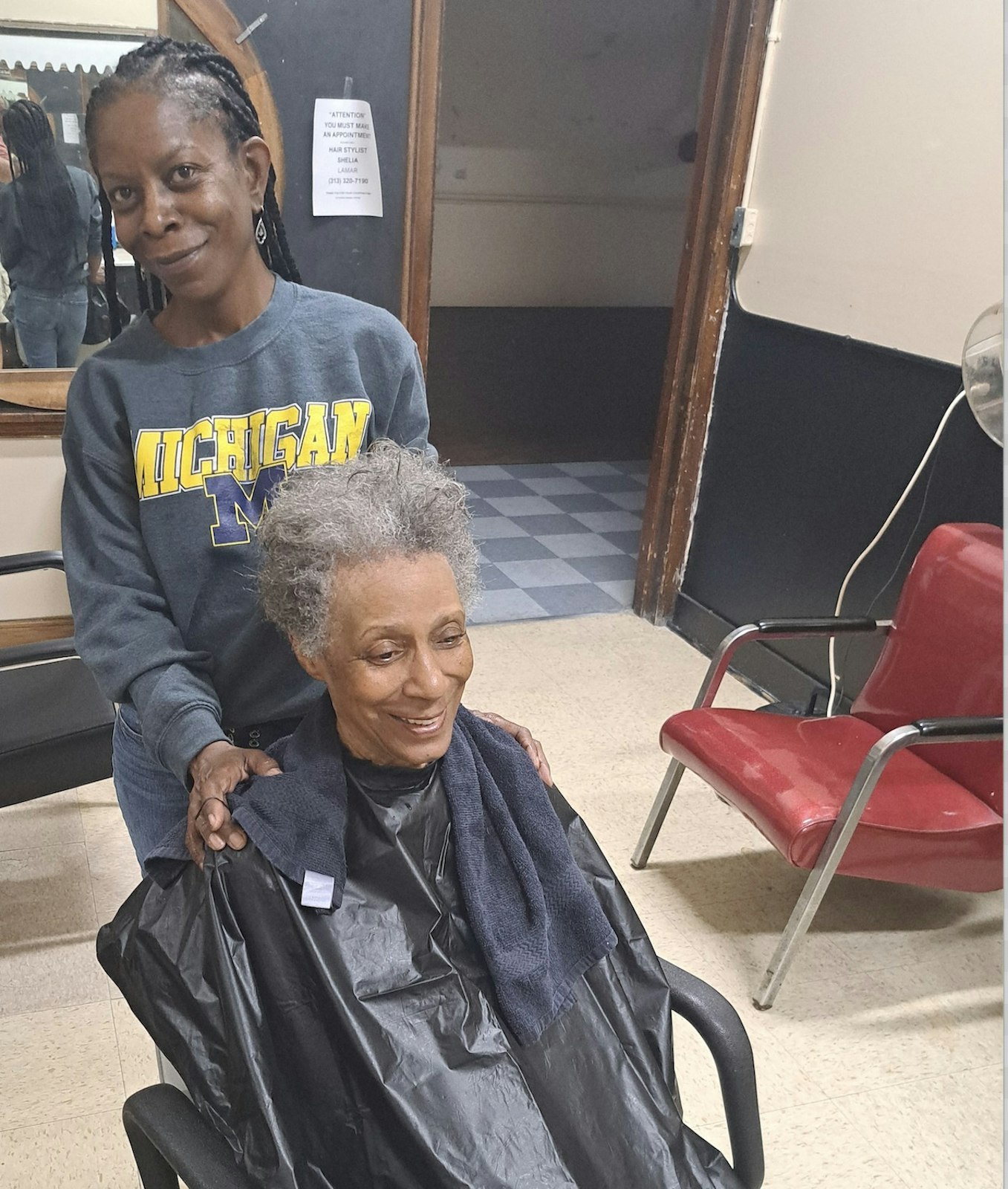 Hair stylist Sheila LaMar styles longtime St. Patrick Senior Center member Gloria Hopkins' hair. LaMar offers hair styling weekly at the Midtown center.