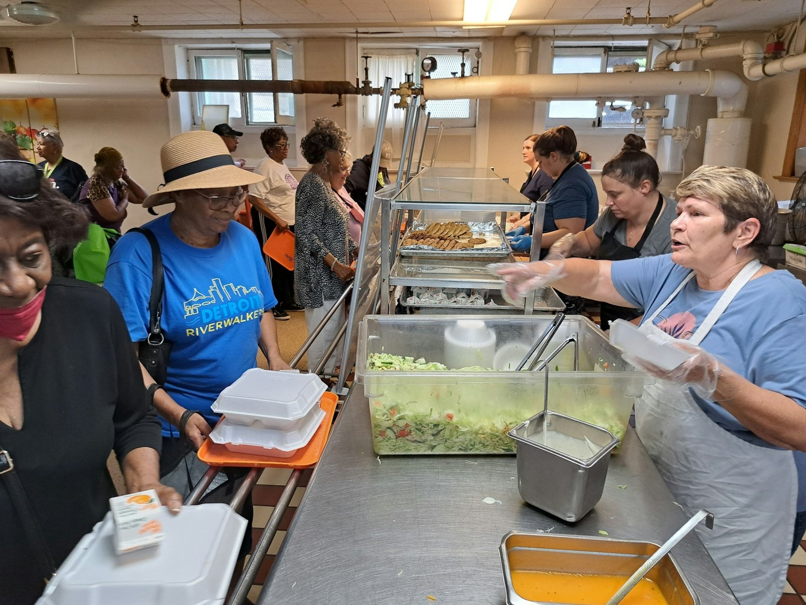 Volunteers serve hot meals at the St. Patrick Senior Center. The center's various activities and programs couldn't be done without the army of volunteers who support its work, leaders say.