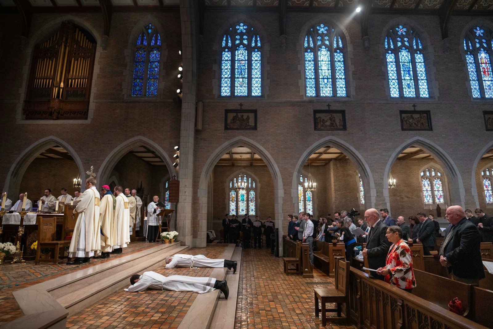 Deacons Bruen and Schroder lie prostrate before the altar inside the chapel of Sacred Heart Major Seminary in Detroit during their ordination Mass.