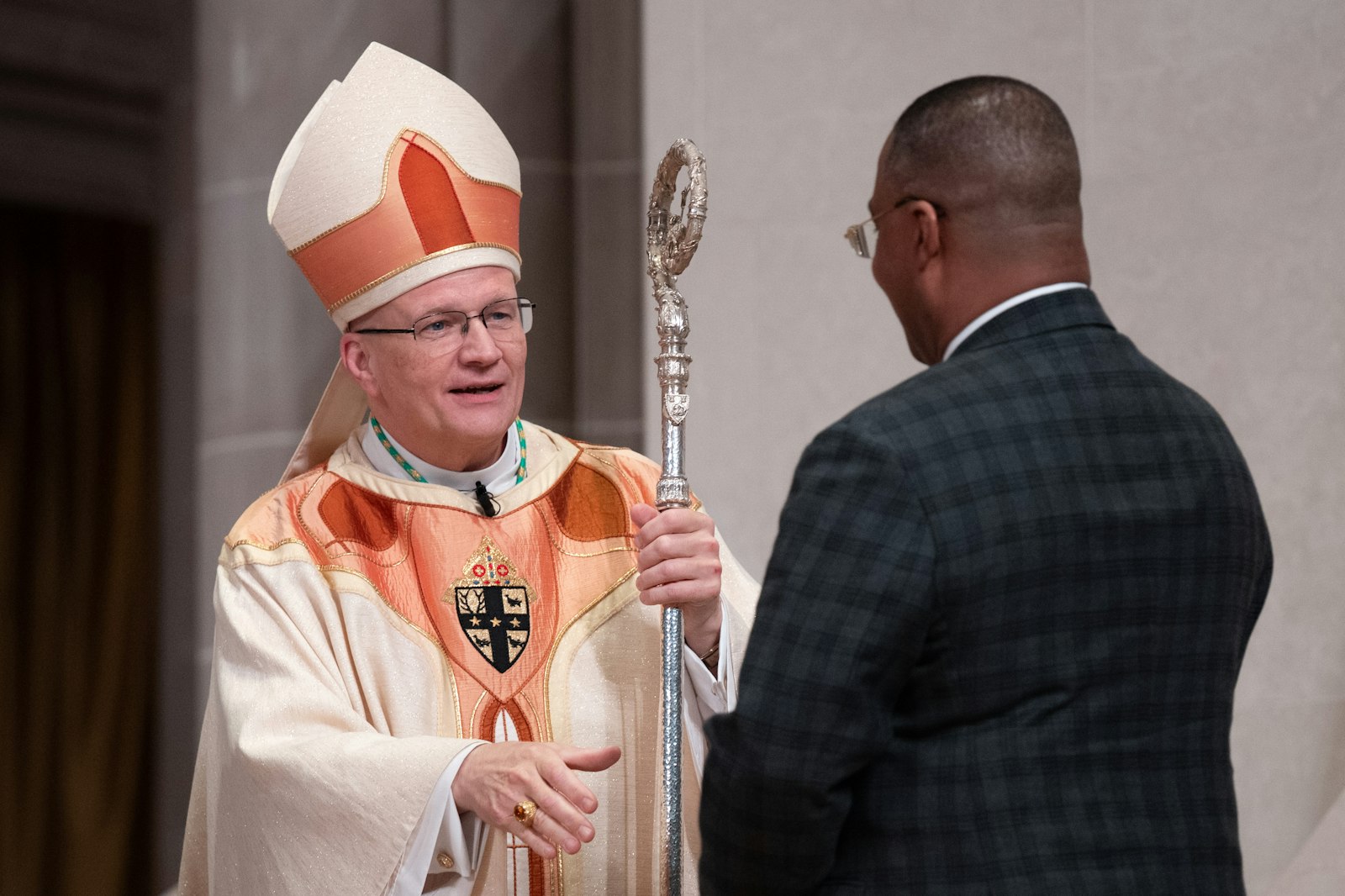 Archbishop Weisenburger greets representatives of the Archdiocese of Detroit, who each offered a few words of welcome on behalf of the body of Christ in southeast Michigan. (Tim Fuller | Special to Detroit Catholic)