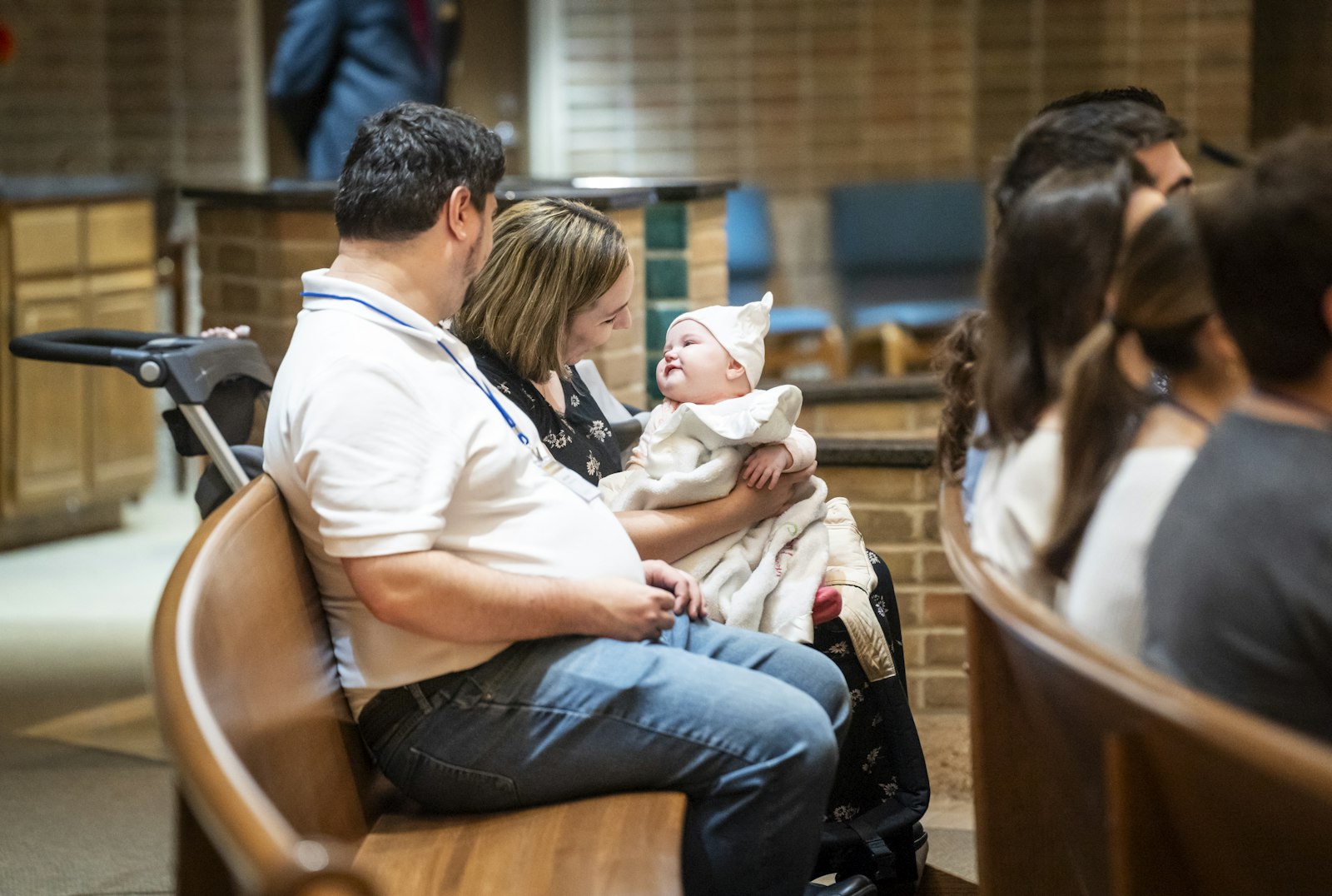 A couple smiles as they hold their newborn. Growing together as a couple is “a mystery,” Archbishop Vigneron said, one built into the life of the Holy Trinity.