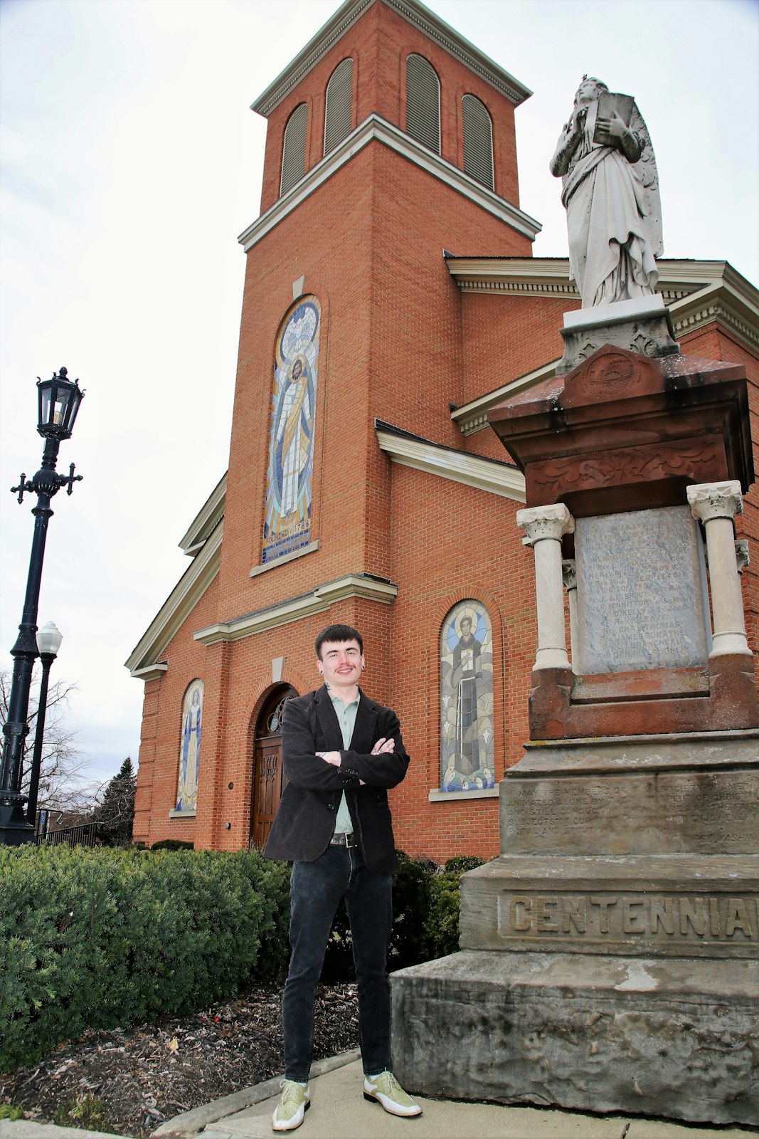Trent Vecchiarino stands outside St. Mary of the Immaculate Conception Parish in Monroe. He plans to choose Blessed Solanus Casey as his confirmation saint and is looking forward to being baptized and receiving Christ for the first time in the Eucharist.