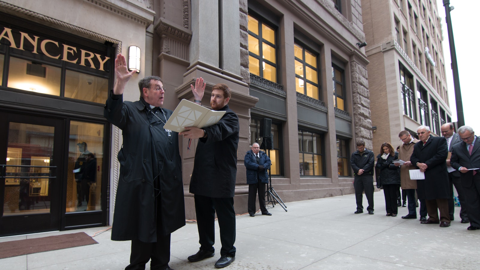 Archbishop Vigneron blesses a new tympanum commissioned for the archdiocesan Chancery in downtown Detroit on Dec. 1, 2016. In 2015, the archbishop led a move from the archdiocese's former Chancery on Washington Boulevard to its new location on State Street, keeping the archdiocese's central headquarters in downtown Detroit. (Jonathan Francis | Detroit Catholic file photo)