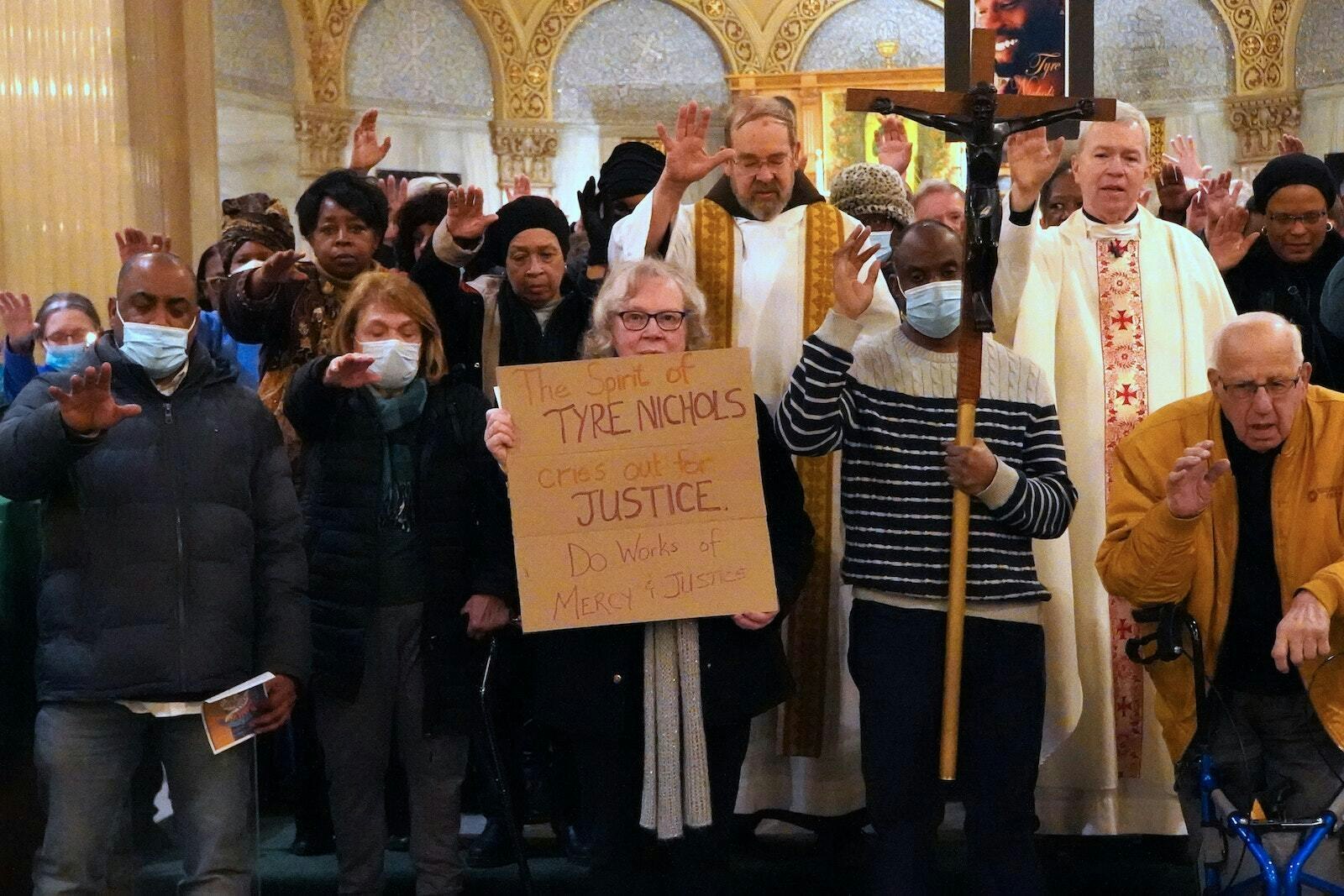 Parishioners and priests from St. Augustine and St. Monica Parish on Detroit's east side and surrounding parishes gather around the altar to pray for Tyre Nichols, his family and the family of the five Memphis police officers who were charged with second-degree murder in February 2023. Msgr. Trapp challenged parishioners to see the presence of Christ in one another. (Daniel Meloy | Detroit Catholic)