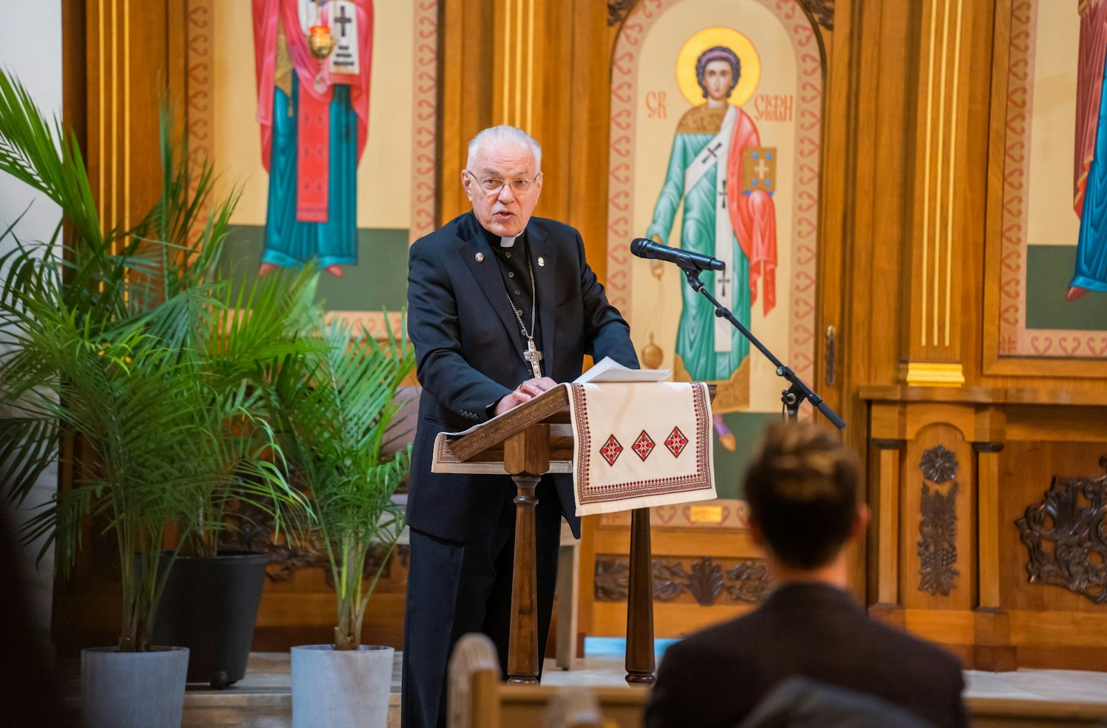 Detroit Auxiliary Bishop Donald Hanchon speaks as a representative of the Archdiocese of Detroit during a Feb. 5 ecumenical prayer vigil at St. Mary the Protectress Ukrainian Orthodox Cathedral in Southfield. Bishop Hanchon called upon the protection of the Blessed Virgin Mary, in her role as Queen of Peace, to cover the people of Ukraine as world leaders seek to diffuse tensions. (Valaurian Waller | Detroit Catholic)