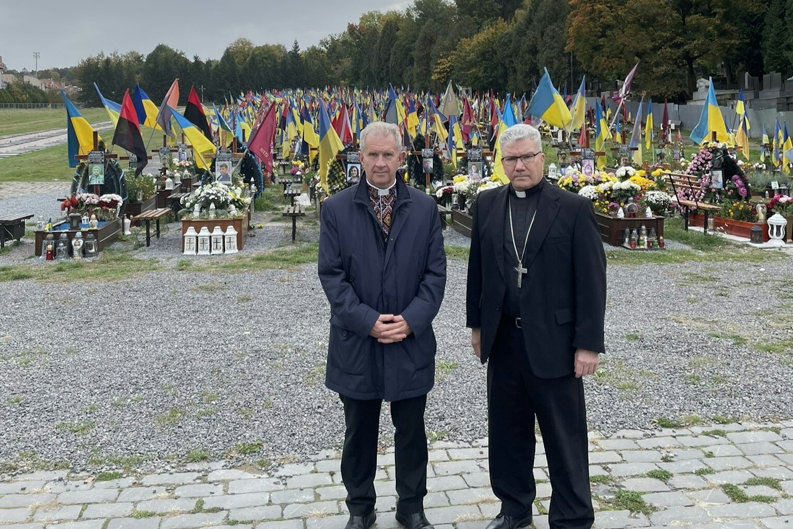 Bishop Monforton stands with Fr. Bohdan Prakh, former president of the Ukrainian Catholic University in Lviv, at a military cemetery in Lviv, Ukraine. While in Lviv, Bishop Monforton spoke with family members who have lost loved ones during the war effort. According to Lviv's mayor, every day the city loses between one and three soldiers killed in the war.