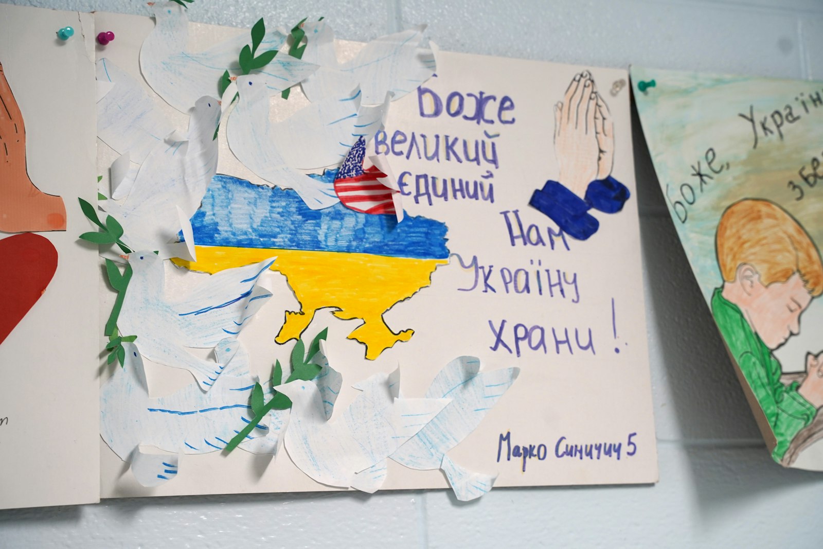 Posters urging prayer for the people of Ukraine are pictured inside a classroom at Immaculate Conception Ukrainian Catholic Schools in Warren. This fall, the school is welcoming up to 100 refugee students who have fled the war in Ukraine.