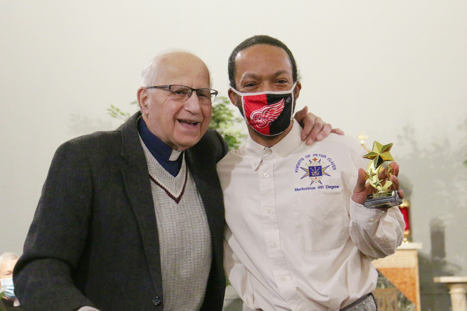 Fr. Norm Thomas, pastor of Sacred Heart Parish in Detroit, smiles alongside Alexander Taylor, who received an Urban Parish Spirit Award for his volunteer work at the parish.