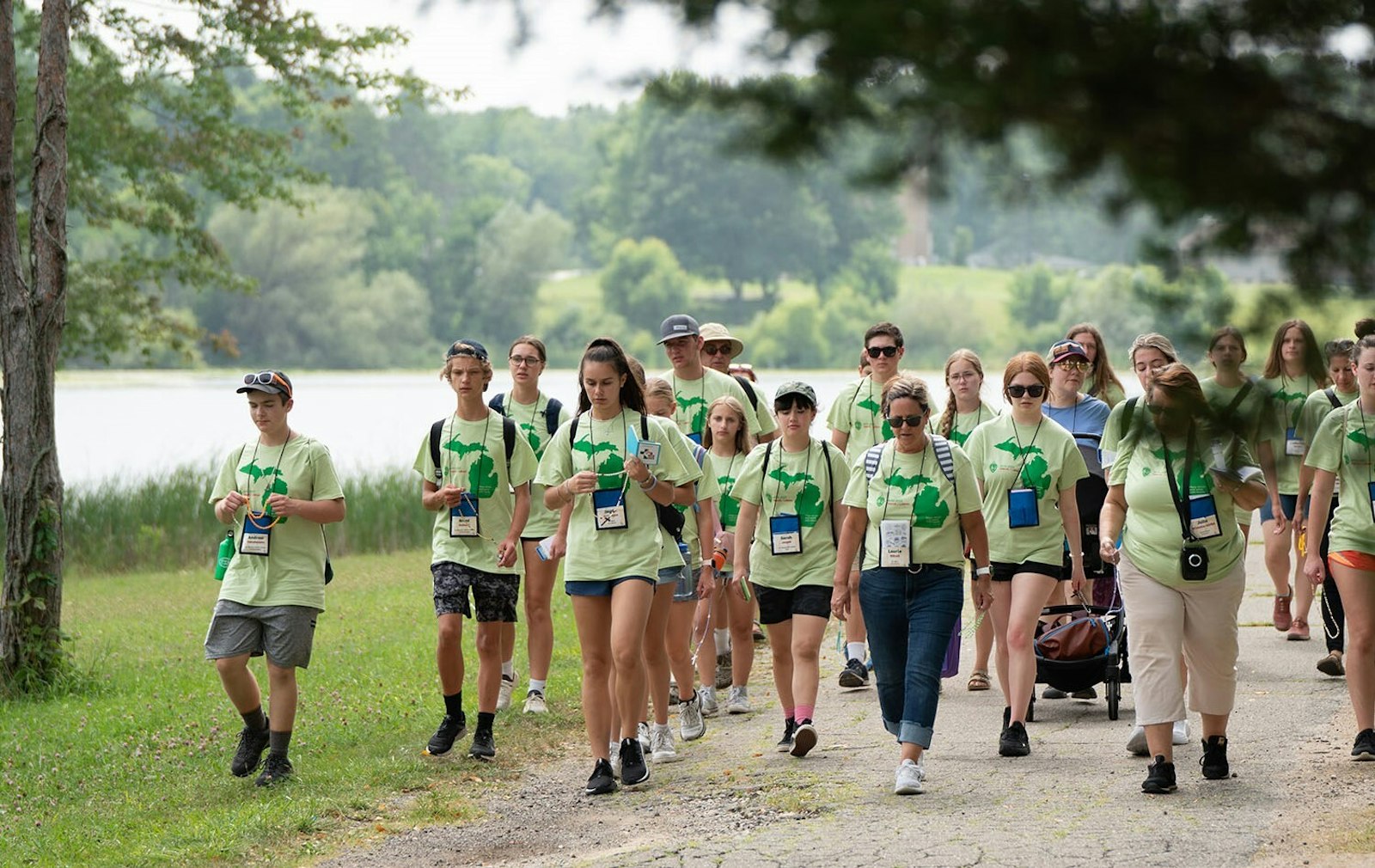 More than 60 young people from the Archdiocese of Detroit take part in a walking rosary pilgrimage around the lake at Our Lady of the Fields Camp in Brighton during a World Youth Day "Home" event Aug. 5, 2023. (Gerardo Butalid | Special to Detroit Catholic)