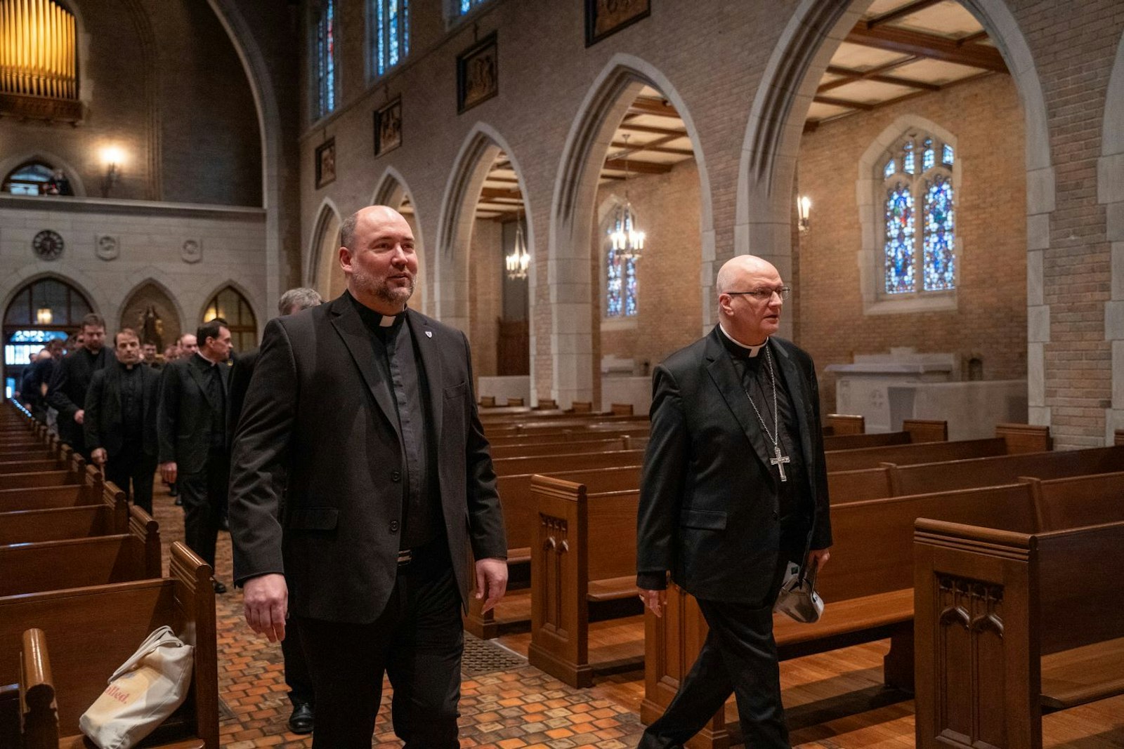 Fr. Stephen Burr, rector of Sacred Heart Major Seminary in Detroit, walks with Archbishop-elect Weisenburger through the chapel at the seminary after he arrived to be introduced as the sixth archbishop of Detroit on Feb. 11.