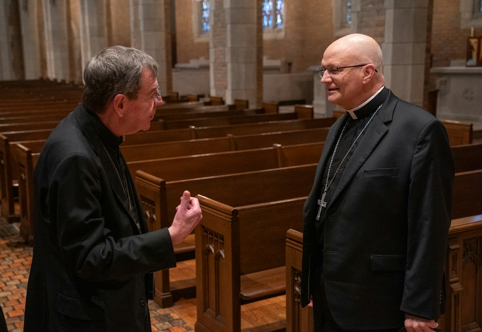 Archbishop Allen H. Vigneron chats with Archbishop-designate Edward J. Weisenburger in Sacred Heart's chapel. Archbishop Vigneron, who has served as Detroit's archbishop since 2009, will live at Sacred Heart Major Seminary after his successor's March 18 installation.