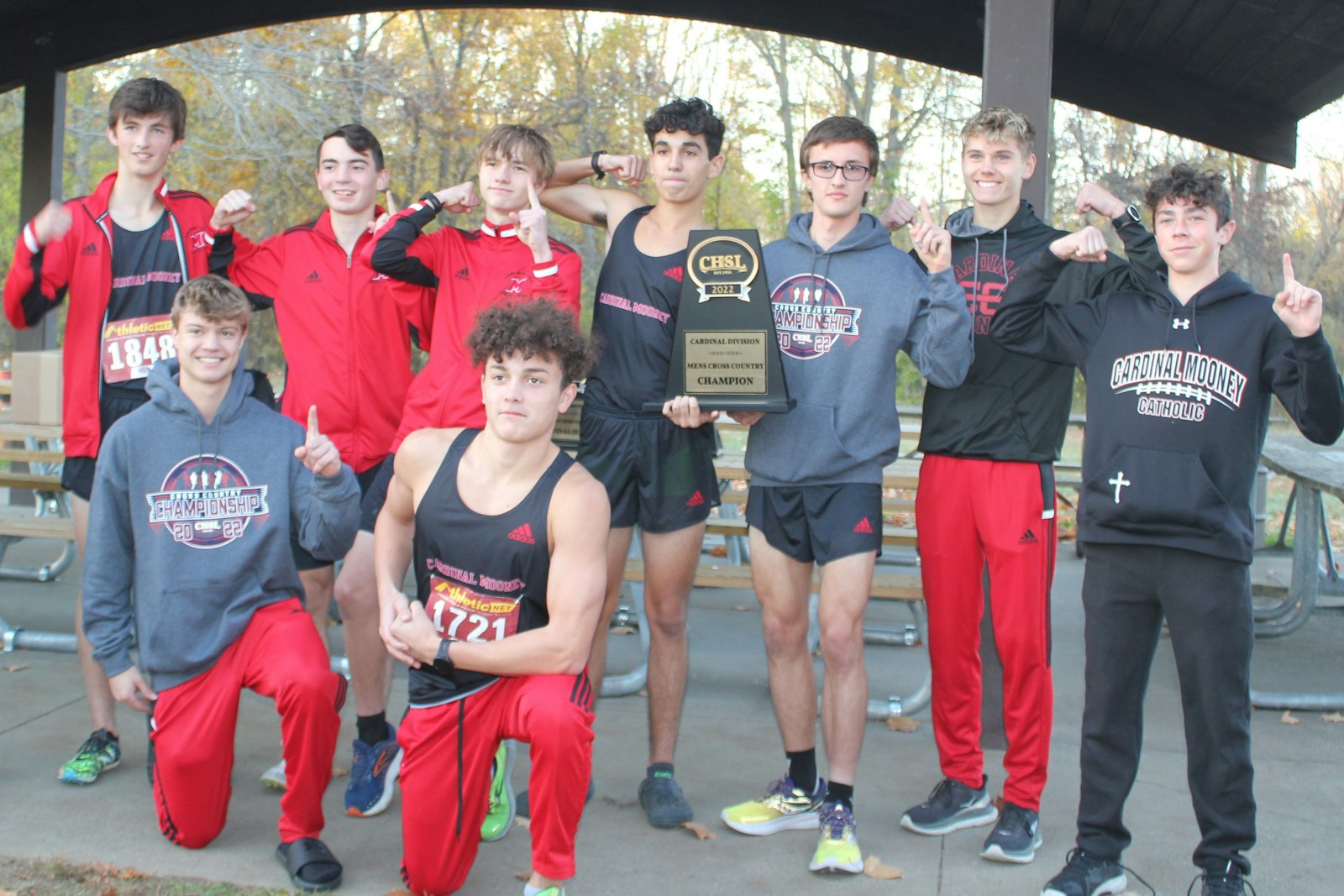 Marine City Cardinal Mooney celebrates its first cross-country championship. The Cardinals finished ahead of 10 other schools in the Cardinal Division race at Willow Metropark.