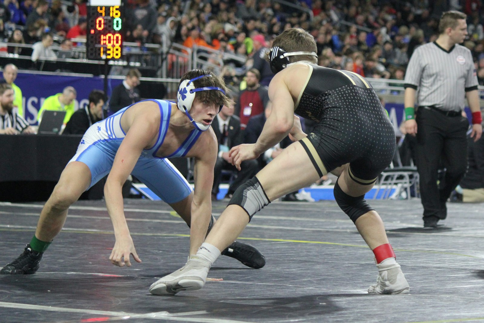 Catholic Central’s Mason Stewart stares down Davison’s Justin Gates in the 138-pound championship. Stewart lost a 2-1 heartbreaker after Gates scored a reversal in the final period.