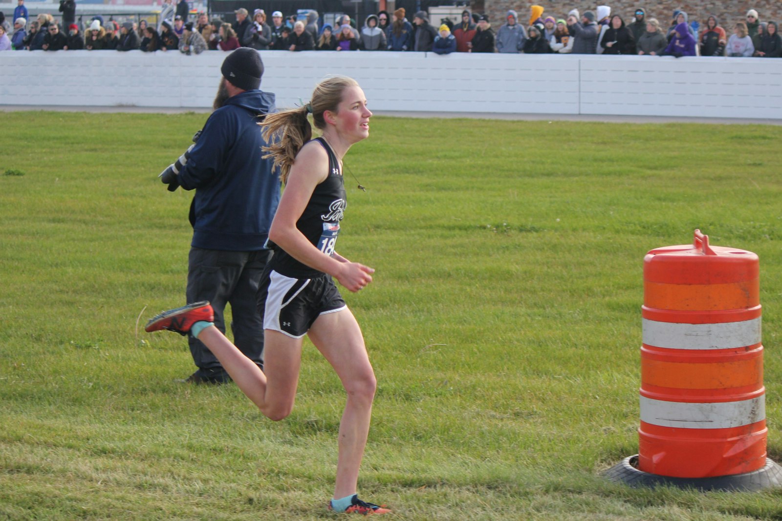 Ann Arbor Fr. Gabriel Richard senior Gianna Hoving sprints toward the finish line in the Division 3 race. Her kick helped her finish 13th individually and earn all-state honors.