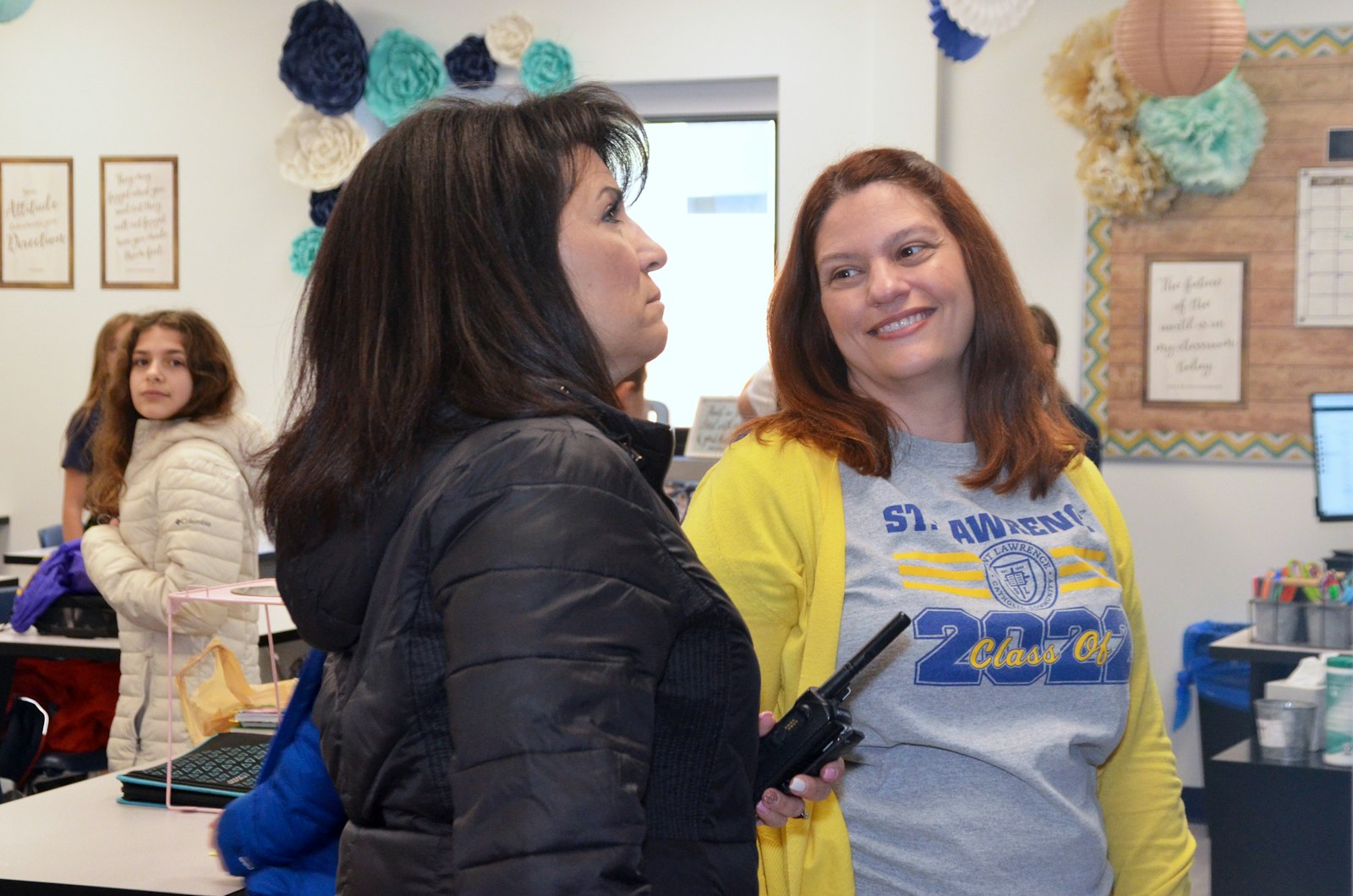 Lisa DiMercurio, principal of St. Lawrence Elementary School, shares a laugh on the "first day of school" at the new middle school building with sixth-grade teacher Heather Gaydos.