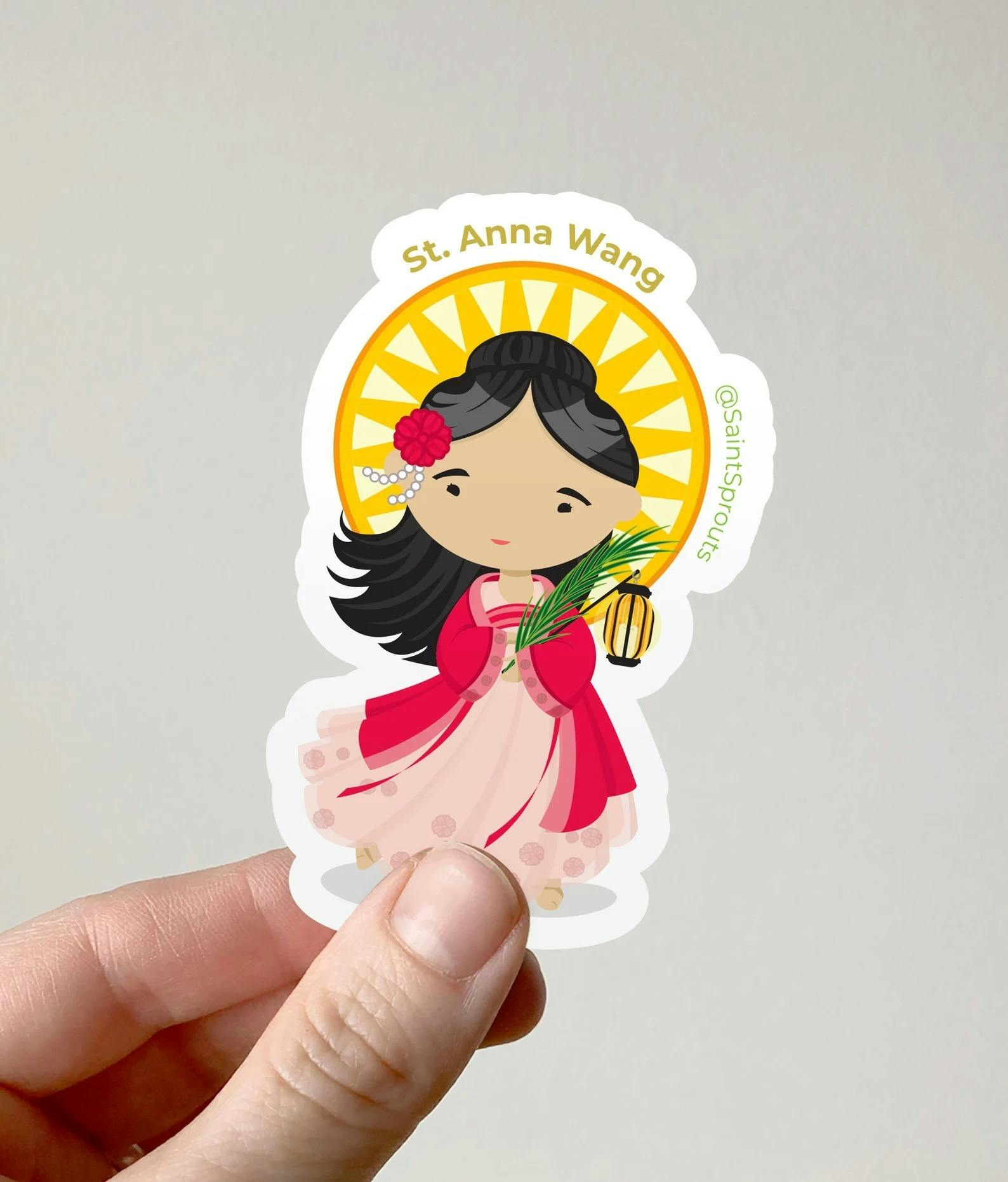 A sticker of St. Anna Wong, a Chinese saint martyred during the Boxer Rebellion. While researching St. Anna, Mattos discovered there were very few pictures of her and she had to be creative in how she portrayed the young saint. (Photo courtesy of Marie Mattos)