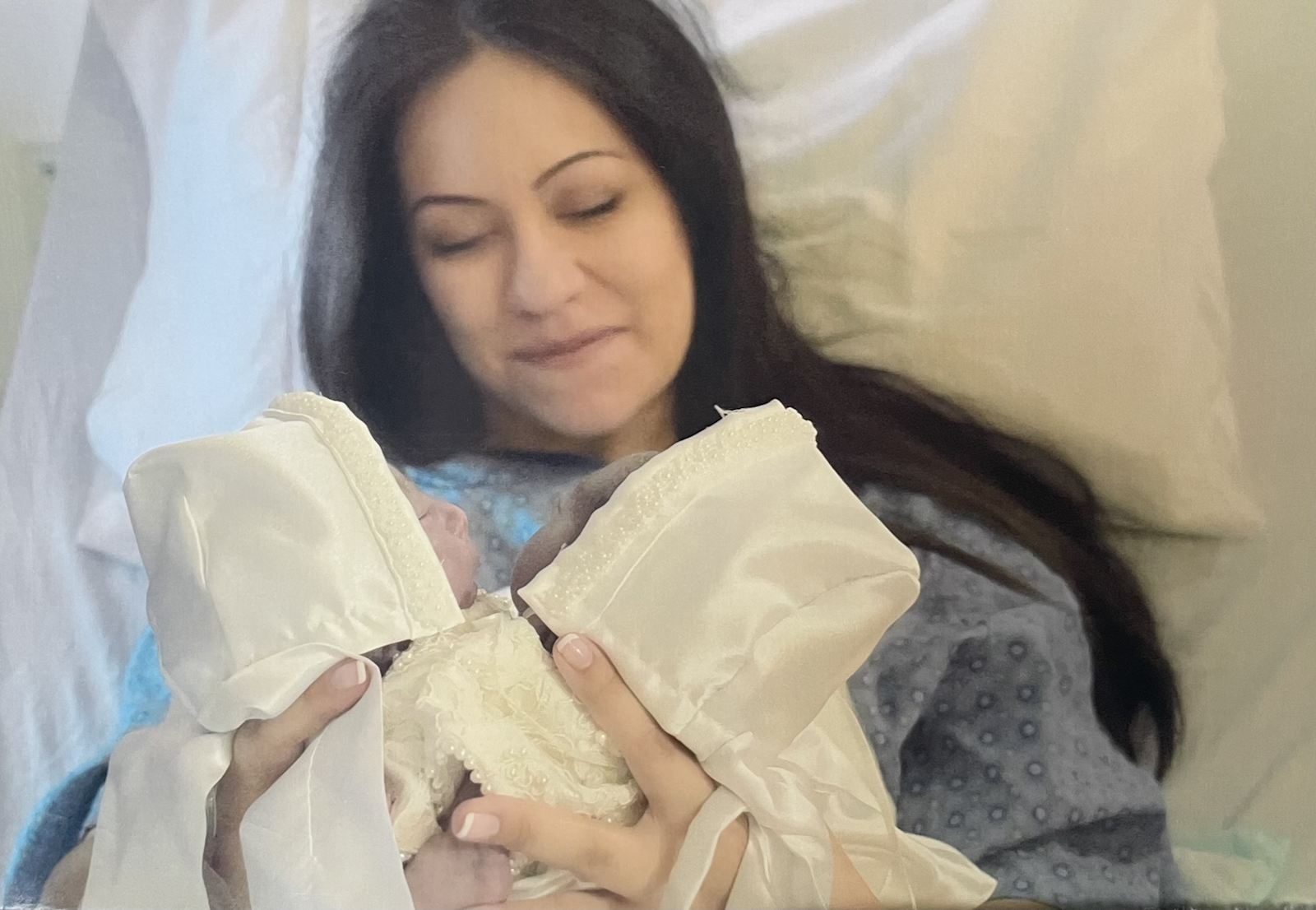 Nicole LeBlanc holds her newborn twins, Maria Teresa and Rachel Clare, moments after their birth May 16. The conjoined sisters lived for just more than an hour, receiving the sacraments of baptism and confirmation from Fr. David Pellican, who has accompanied the family along their difficult pregnancy. (Courtesy of Nicole LeBlanc)