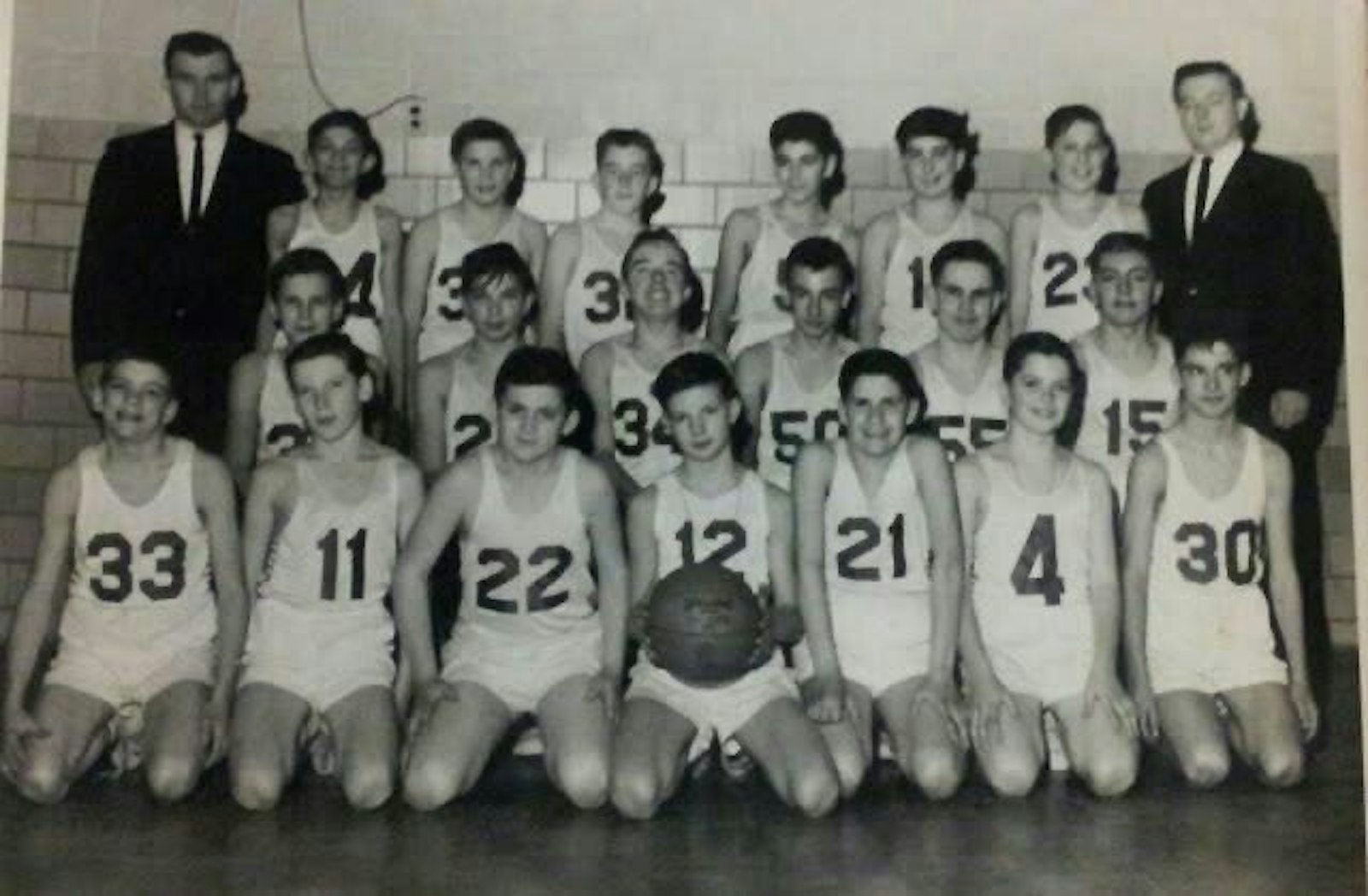 The eighth-grade basketball team from St. Gregory Grade School in Detroit with former CYO director Joe Charnley (No. 11) and coached by Fr. George Charnley and his good friend, Tom Watters.