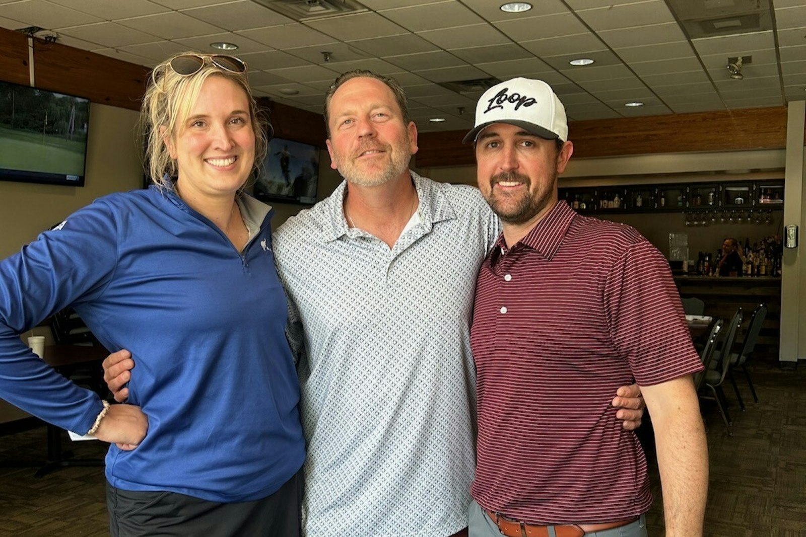 Lisa Kullman, Joe Charnley and Jeff Kator gather after the family's first golf outing for The Charnley Foundation. More than 100 people came out to support the event.