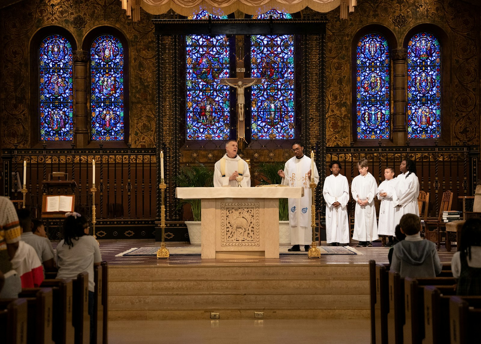 Fr. Lorn Snow, SJ, pastor at Gesu, celebrates Mass alongside Fr. Smith on May 31. After attending Gesu Catholic School as a child, Fr. Smith attended and graduated from University of Detroit Jesuit High School before eventually discerning the priesthood.