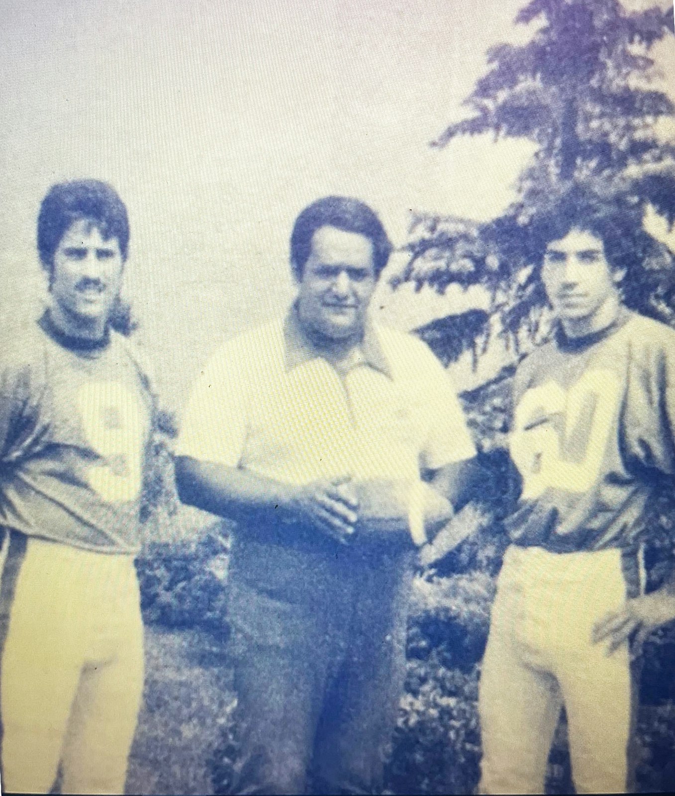 A proud moment for the Bishop Gallagher co-captains of the 1978 Double A Division champions: John Stavale, left, coach George Sahadi and John Simoncini.