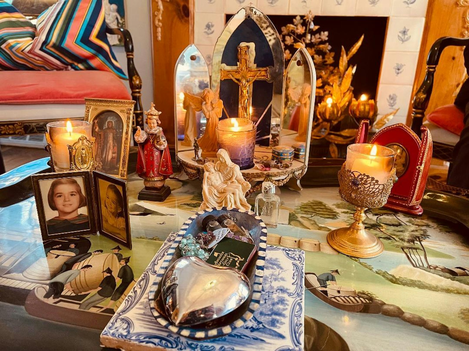 Three candles representing the Father, Son and Holy Spirit stand alight in Kathleen McInerney's home "chapel," where she goes to pray and find inspiration for her work.