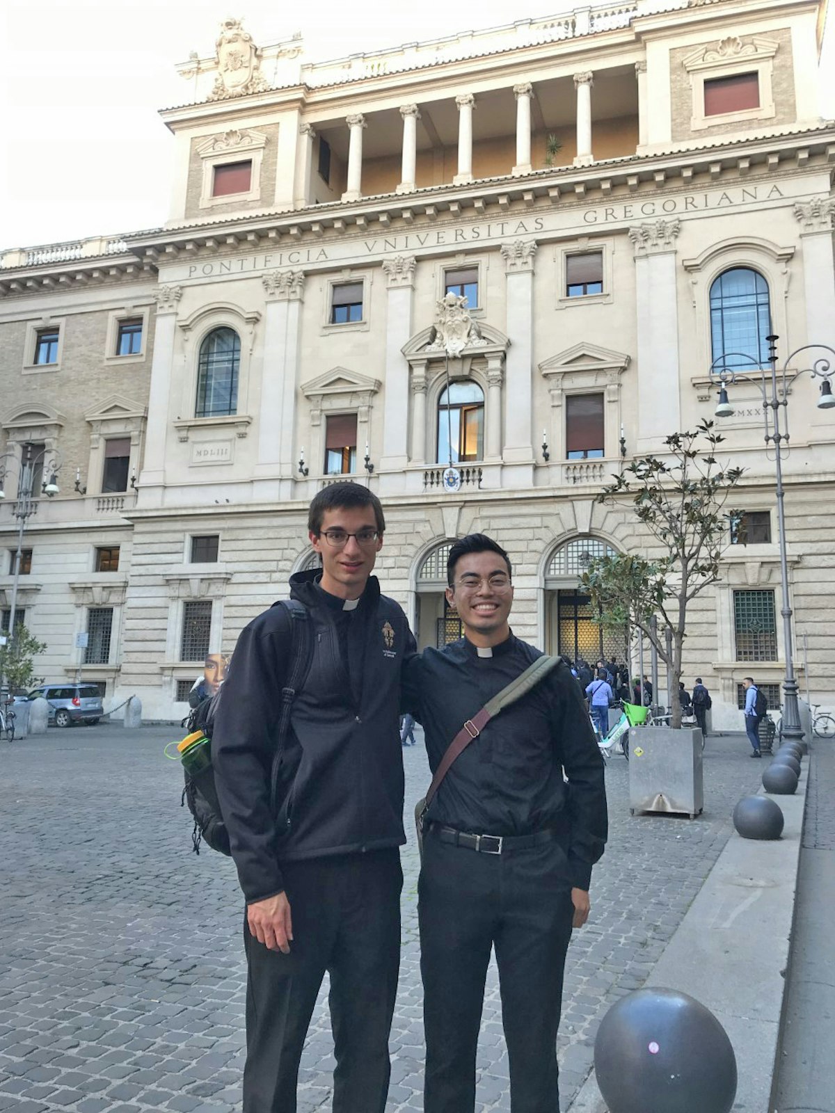 Ryan Asher, left, a seminarian studying for the priesthood for the Archdiocese of Detroit, stands with classmate Joshua Burcroff, also studying for the Archdiocese of Detroit, outside the Pontifical Gregorian University in Rome, where seminarians attending the Pontifical North American College attend classes with seminarians and professors from around the world.