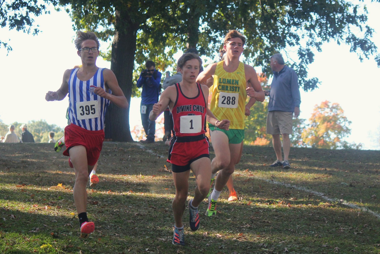 Dearborn Divine Child’s Colin Murray (1) takes control on a downhill stretch in the first mile of the race. He’s being pursued by Toledo St. Francis de Sales’ Colton Adolph (395) and Jackson Lumen Christi’s Leo Swager (288).