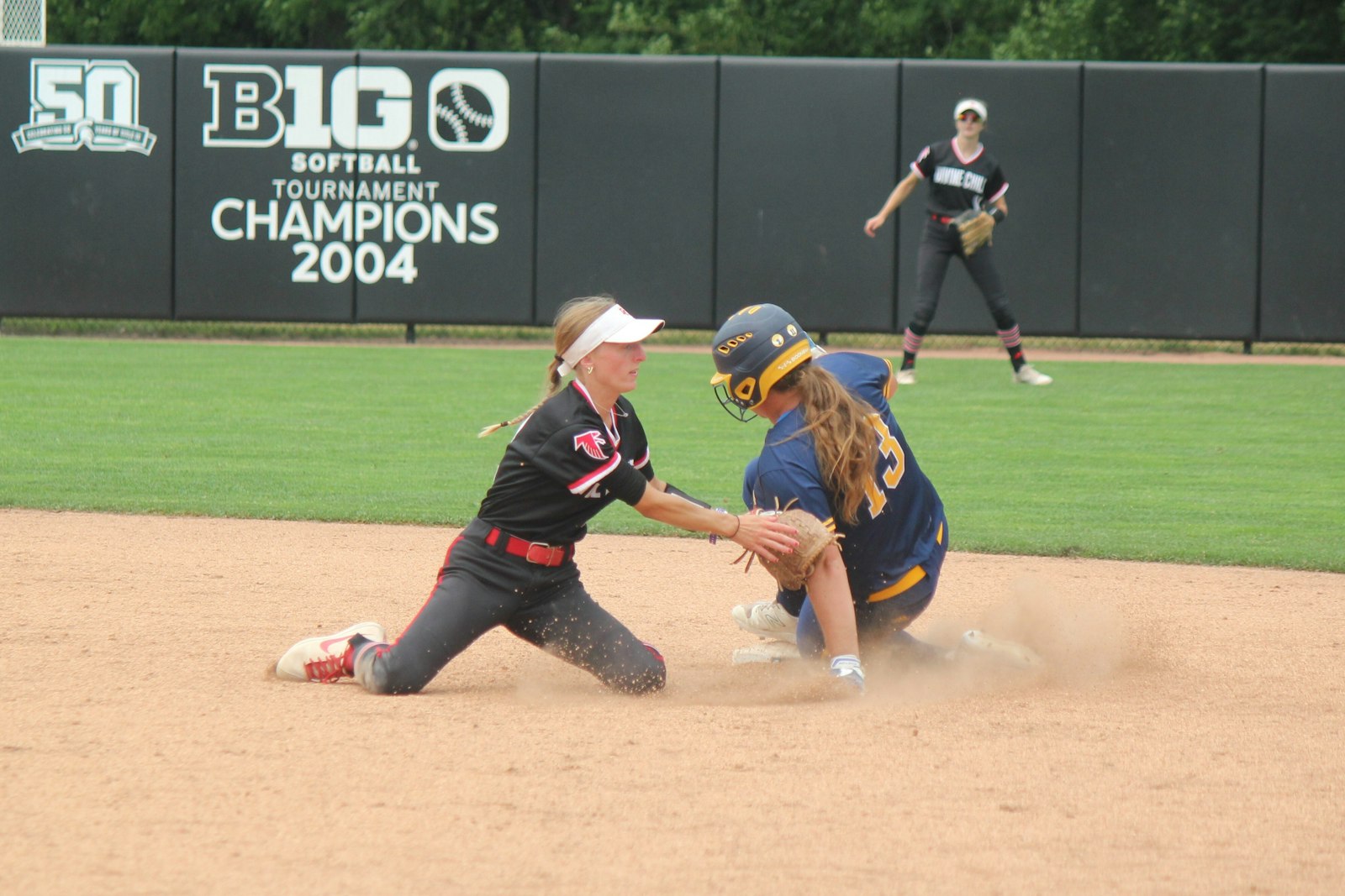 Divine Child shortstop Avery Schllenburger applies the tag to retire Gaylord’s Hali Lenartowicz on a stolen-base attempt in the fifth inning.
