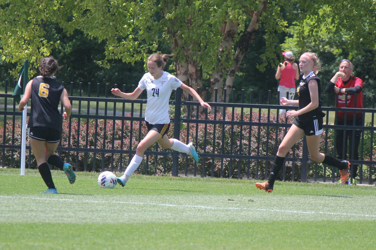 Erica Walker, whose goal in the semi-final earned the Mountaineers a berth in the championship game, takes the ball in from the right side of the goal box while being pursued by Kalamazoo Christian’s Maysen Steensma and Phoebe Zeyl.