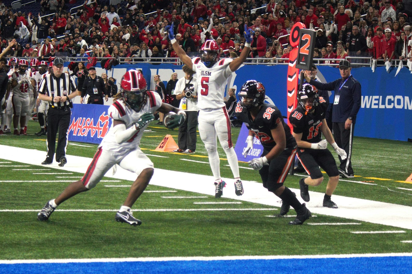 Darrin Jones celebrates at Bryson Williams crosses the goal line late in the second quarter, as Orchard Lake St. Mary’s worked back from an early deficit in the MHSAA Division 2 state title game.